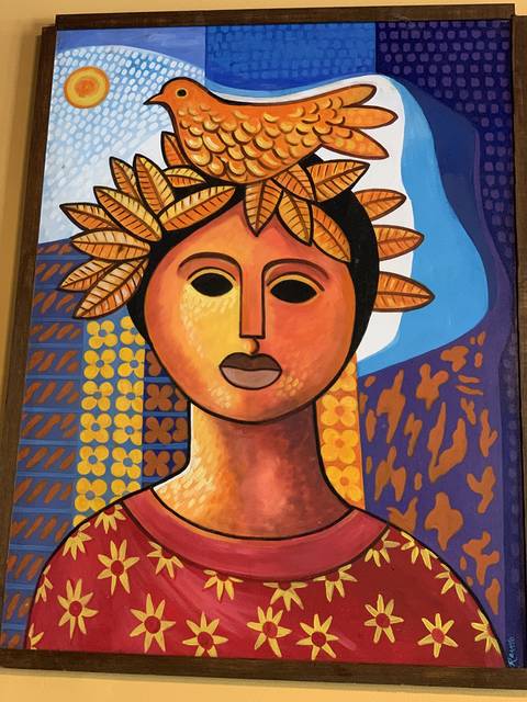 Folk art painting on the dining room wall