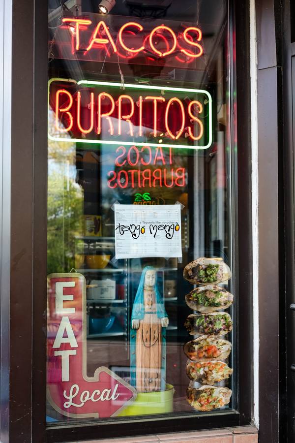 The Tango Mango storefront window with its neon Tacos and Burritos sign
